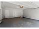 Spacious two car garage with storage and painted walls and floor at 1667 Wehunt Se Pl # 11, Smyrna, GA 30082