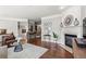 Spacious living room with fireplace and stylish decor, complemented by hardwood floors and a neutral color palette at 1667 Wehunt Se Pl # 11, Smyrna, GA 30082