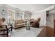 Open-concept living area with neutral tones, hardwood floors, and natural light, perfect for relaxation and entertaining at 1667 Wehunt Se Pl # 11, Smyrna, GA 30082