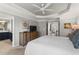 Spacious primary bedroom with tray ceilings, fan, and en-suite bathroom with double vanity at 1667 Wehunt Se Pl # 11, Smyrna, GA 30082