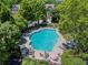 Beautiful community pool area surrounded by lush landscaping and lounge chairs at 1667 Wehunt Se Pl # 11, Smyrna, GA 30082