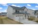 Well-maintained two-story home featuring a side-entry garage and lush landscaping at 1841 Lacebark Elm Way, Lawrenceville, GA 30045