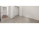 Bedroom features neutral carpet and paint, and an adjacent walk in closet at 1871 Lacebark Elm Way Way, Lawrenceville, GA 30045