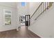 Bright foyer with soaring ceilings, luxury vinyl plank flooring and an open view to the front exterior at 1871 Lacebark Elm Way Way, Lawrenceville, GA 30045