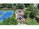 Aerial view of community playground and tennis courts surrounded by lush trees at 2678 Adair Trl, Dacula, GA 30019