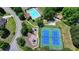 Aerial view of community pool, playground, tennis courts, and clubhouse at 2678 Adair Trl, Dacula, GA 30019