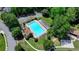 Aerial view of community pool with lounge chairs and shade structures at 2678 Adair Trl, Dacula, GA 30019