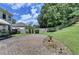 Brick patio with bird bath and landscaped garden area at 2678 Adair Trl, Dacula, GA 30019