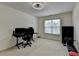 Carpeted bedroom featuring a ceiling fan, natural light, space for a desk and workout bench at 2678 Adair Trl, Dacula, GA 30019