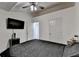 This bedroom has doors leading into other rooms, with a television mounted to the wall at 2678 Adair Trl, Dacula, GA 30019