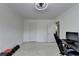 Carpeted bedroom featuring a ceiling fan, natural light, and space for an office at 2678 Adair Trl, Dacula, GA 30019