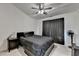 This bedroom has a ceiling fan, and it is well lit with natural and artifical light at 2678 Adair Trl, Dacula, GA 30019