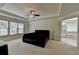 Spacious primary bedroom with an en-suite bathroom and a tray ceiling with a ceiling fan at 2678 Adair Trl, Dacula, GA 30019
