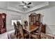 Formal dining room with elegant wood table, chairs, hutch, and tray ceiling at 2678 Adair Trl, Dacula, GA 30019