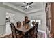 Elegant dining room boasts a tray ceiling and beautiful wood furniture at 2678 Adair Trl, Dacula, GA 30019