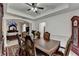 Dining room with wood table and chairs, a rug and a glimpse into the bedroom at 2678 Adair Trl, Dacula, GA 30019