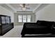 Large main bedroom featuring trey ceiling, plush carpet, and ceiling fan with crystal light at 2678 Adair Trl, Dacula, GA 30019