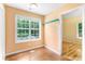 Dining area with hardwood floors, a window, and access to the kitchen at 2700 White Blossom Ln, Suwanee, GA 30024