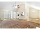 Spacious living room featuring vaulted ceilings, ceiling fan, and hardwood floors with lots of natural light at 2700 White Blossom Ln, Suwanee, GA 30024
