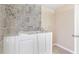 View of tiled walk-in tub in primary bathroom at 2700 White Blossom Ln, Suwanee, GA 30024
