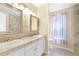 View of dual sink vanities with decorative mirrors and lighting in the primary bathroom at 2700 White Blossom Ln, Suwanee, GA 30024