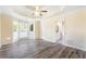 The primary bedroom features a tray ceiling, ceiling fan, bay window and ensuite bathroom at 2700 White Blossom Ln, Suwanee, GA 30024
