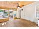 Relaxing sun room features wood ceiling and door leading to outdoor patio at 2700 White Blossom Ln, Suwanee, GA 30024