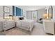 Comfortable bedroom featuring a neatly made bed, side tables, and chic decor for a cozy and inviting space at 5595 Rosehall Pl, Atlanta, GA 30349