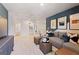 Cozy living room featuring a comfortable sectional sofa and modern decor at 5595 Rosehall Pl, Atlanta, GA 30349