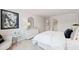 Elegant primary bedroom with a large bed, modern decor, and a light and airy feel at 5595 Rosehall Pl, Atlanta, GA 30349