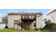 Spacious backyard featuring a wooden deck and stairs leading to the yard at 820 Tradd Ct, Stone Mountain, GA 30087