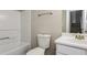 Bathroom with tub and shower, with neutral walls and tiled floors at 820 Tradd Ct, Stone Mountain, GA 30087