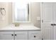 Bright bathroom featuring white cabinetry, white countertop, and silver fixtures at 820 Tradd Ct, Stone Mountain, GA 30087
