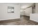 Inviting open floorplan with hardwood floors connecting the living and dining areas at 820 Tradd Ct, Stone Mountain, GA 30087