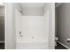 All-white shower and tub combination at 820 Tradd Ct, Stone Mountain, GA 30087