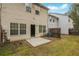 Exterior view of the back of the home with a patio and fenced yard at 1341 Rogers Trce, Lithonia, GA 30058