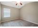 Bedroom with a window for natural light, and a ceiling fan for comfort at 1341 Rogers Trce, Lithonia, GA 30058