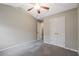 Bedroom with ceiling fan, plush carpeting and bi-fold closet doors for ample storage at 1341 Rogers Trce, Lithonia, GA 30058