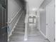 Welcoming entryway showcasing stairs, grey walls, white trim, and a glimpse into the living area at 1341 Rogers Trce, Lithonia, GA 30058