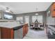 Beautiful kitchen featuring stainless steel appliances and an adjacent dining area with seating for four at 1341 Rogers Trce, Lithonia, GA 30058