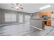 Spacious living room has ample natural light, ceiling fan and wood-look flooring at 1341 Rogers Trce, Lithonia, GA 30058