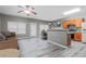 Open concept living room and kitchen area with hardwood style flooring, grey walls, and modern furnishings at 1341 Rogers Trce, Lithonia, GA 30058