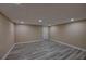 Spacious basement featuring durable flooring, neutral walls, and recessed lighting at 535 Toonigh Rd, Woodstock, GA 30188