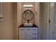 Stylish powder room featuring a vessel sink on a modern vanity with sleek fixtures at 535 Toonigh Rd, Woodstock, GA 30188
