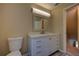 Bathroom features a modern vanity with a quartz countertop, undermount sink, and ample storage at 535 Toonigh Rd, Woodstock, GA 30188