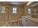Bright bathroom featuring a glass shower enclosure, modern vanity, and a neutral color scheme at 535 Toonigh Rd, Woodstock, GA 30188