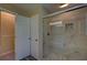 Renovated bathroom with a glass-enclosed shower, tiled walls, and modern fixtures at 535 Toonigh Rd, Woodstock, GA 30188