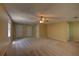 Spacious bedroom with neutral carpet, ceiling fan, and multiple closets offering ample storage at 535 Toonigh Rd, Woodstock, GA 30188