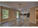 Open concept dining area that flows into the kitchen with modern flooring, and natural light at 535 Toonigh Rd, Woodstock, GA 30188