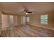 Spacious primary bedroom with ample closet space and hardwood flooring at 535 Toonigh Rd, Woodstock, GA 30188